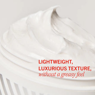 White cream forms gentle peaks, emphasizing its texture, in a smooth container. Red text overlays describe it as "LIGHTWEIGHT, LUXURIOUS TEXTURE, without a greasy feel." Neutral background enhances visibility.